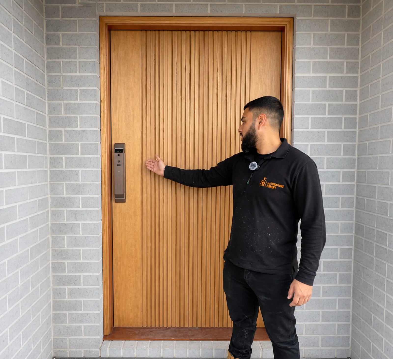 Bronze V2 smart lock installed on a warm timber entrance