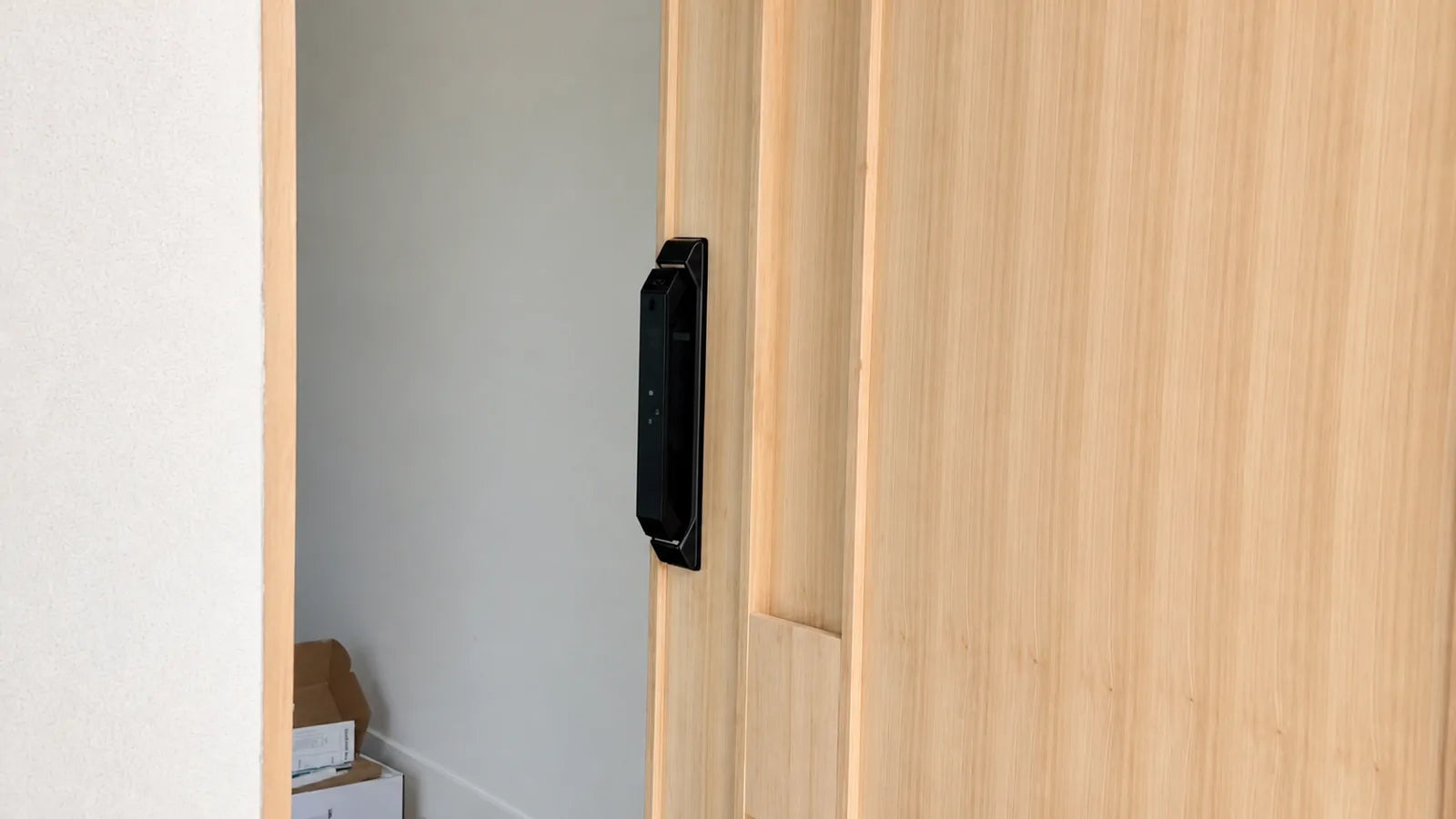 V2 smart lock installed on a light timber entrance